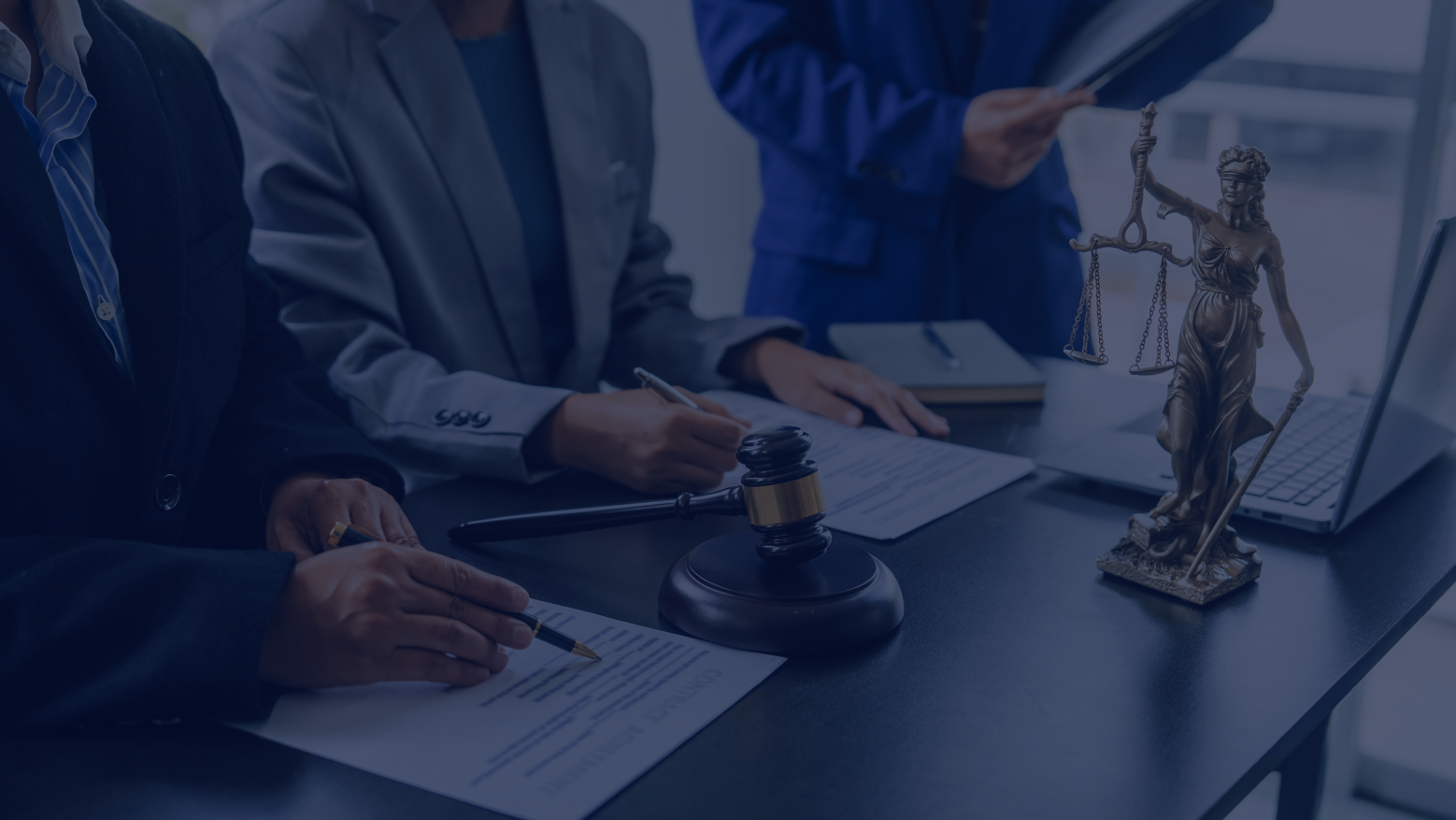 Legal professionals collaborating in a modern workplace environment.