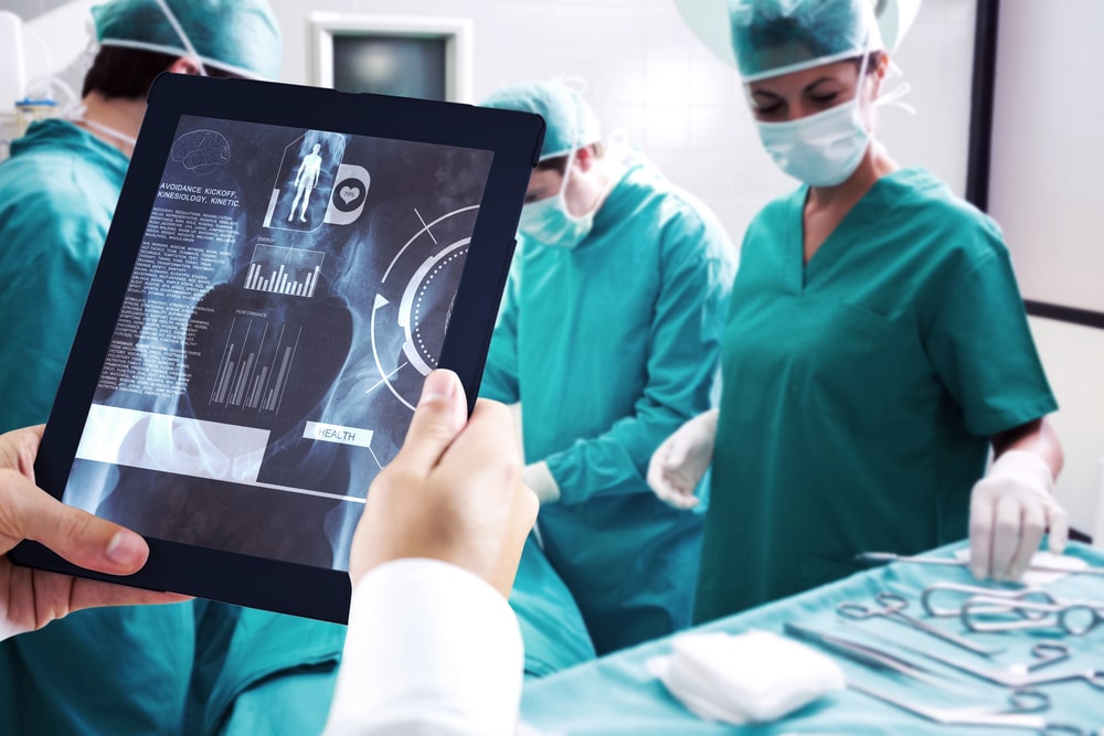 Man,Using,Tablet,Pc,Against,Medical,Interface,On,Xray