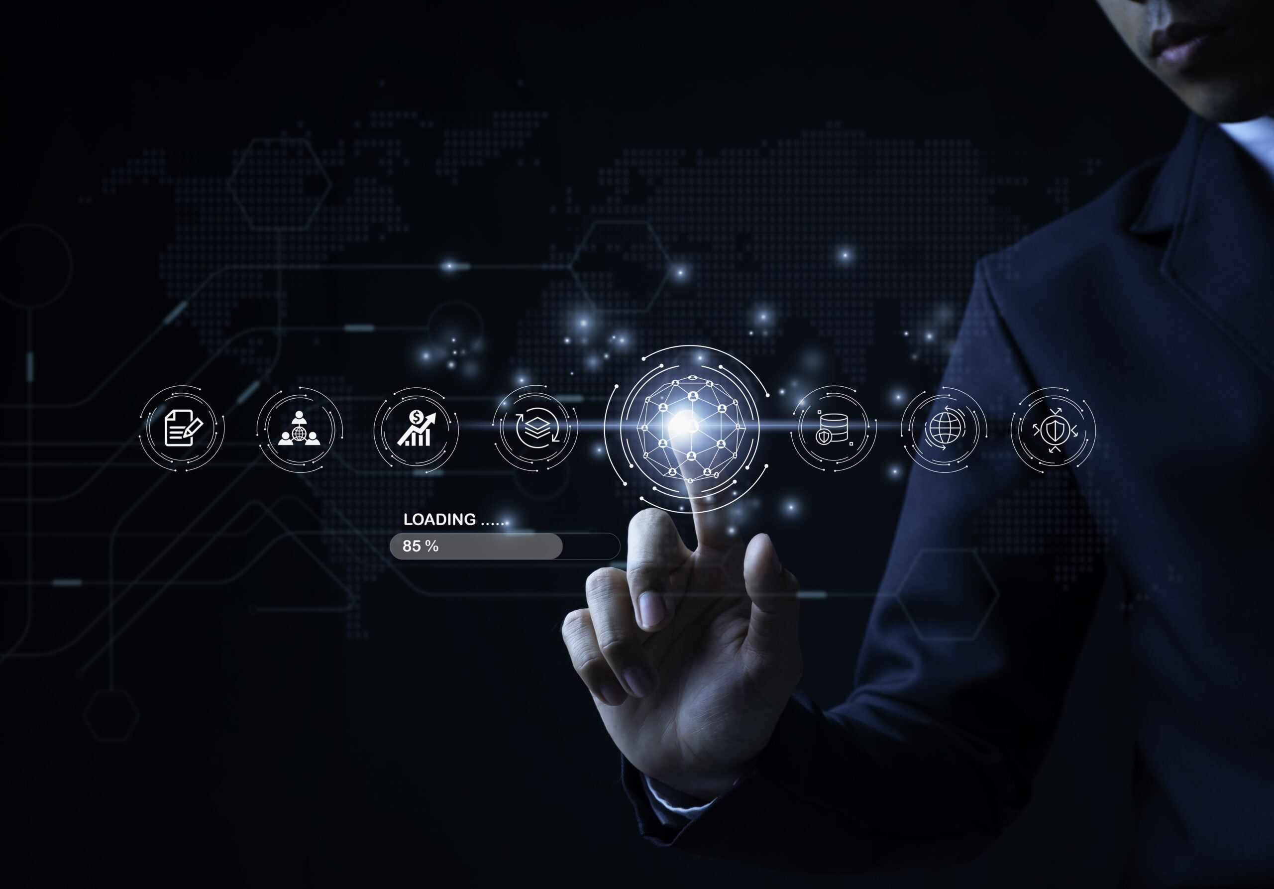 Business professional in a dark suit interacting with a futuristic digital interface, touching a glowing circular icon among multiple technology-related icons, with a world map and network graphics in the background.
