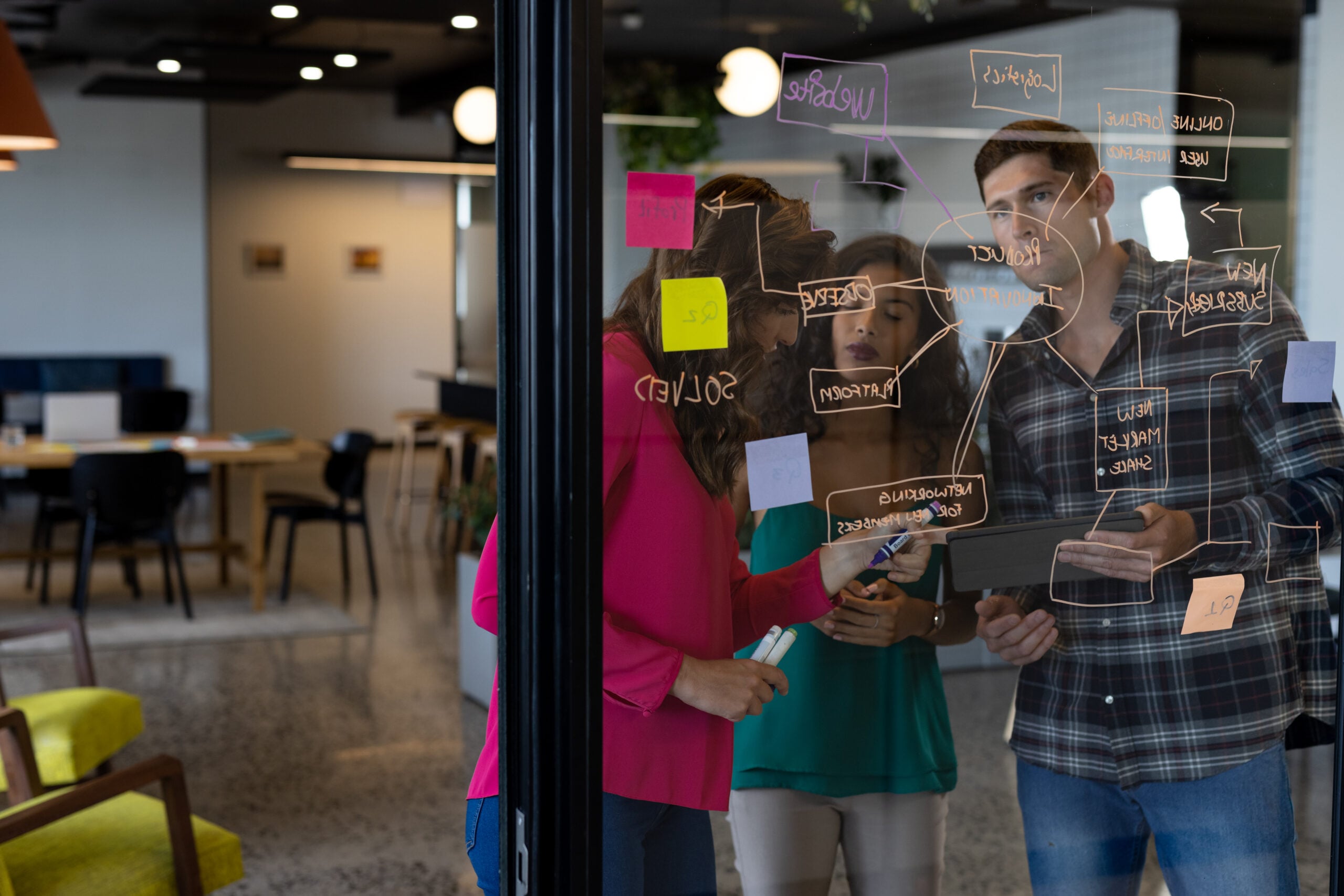 Team reviewing insights and feedback during AI pilot delivery workshop