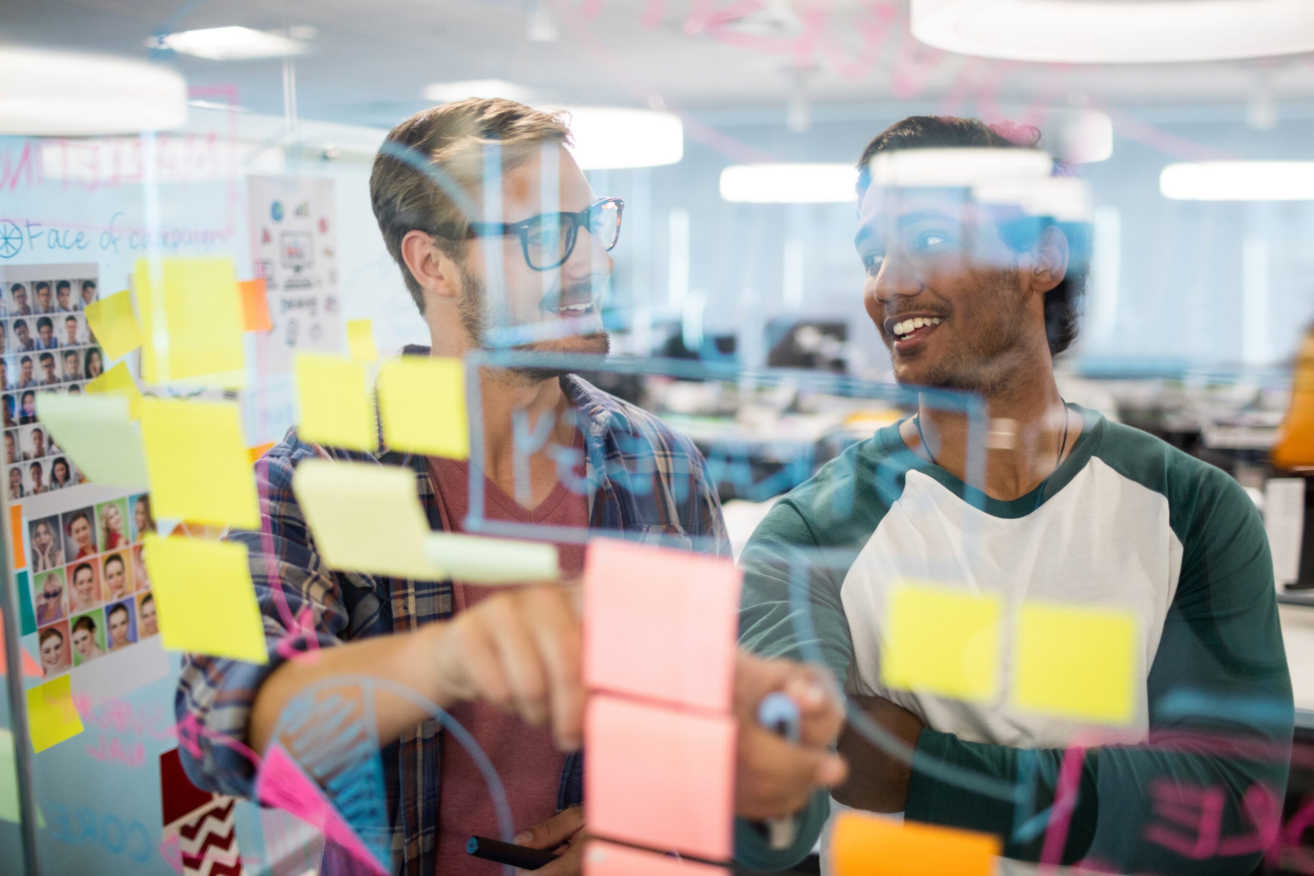 Team working with data and AI analytics on laptops in a modern office environment
