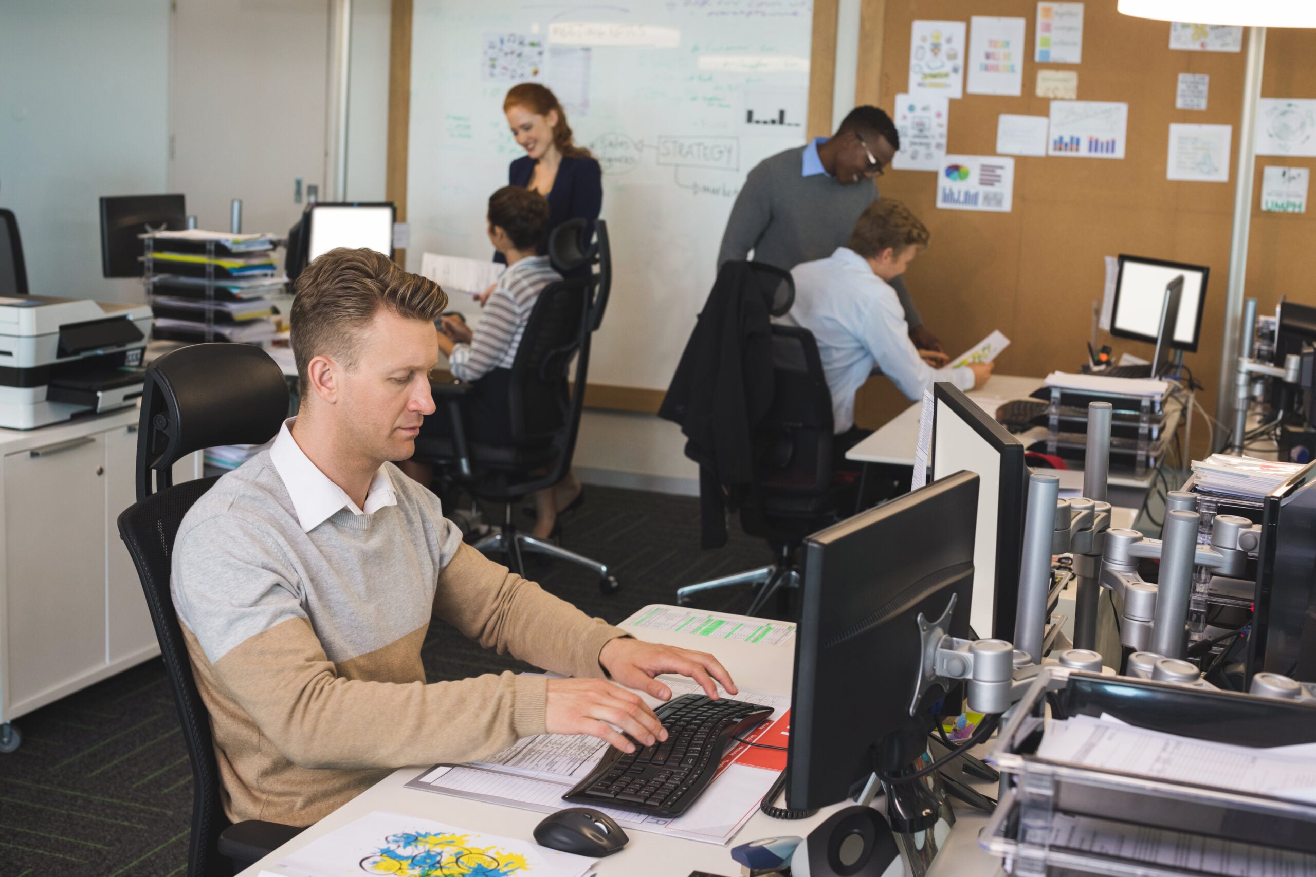 Professional working on data platform reporting and analysis at a workstation
