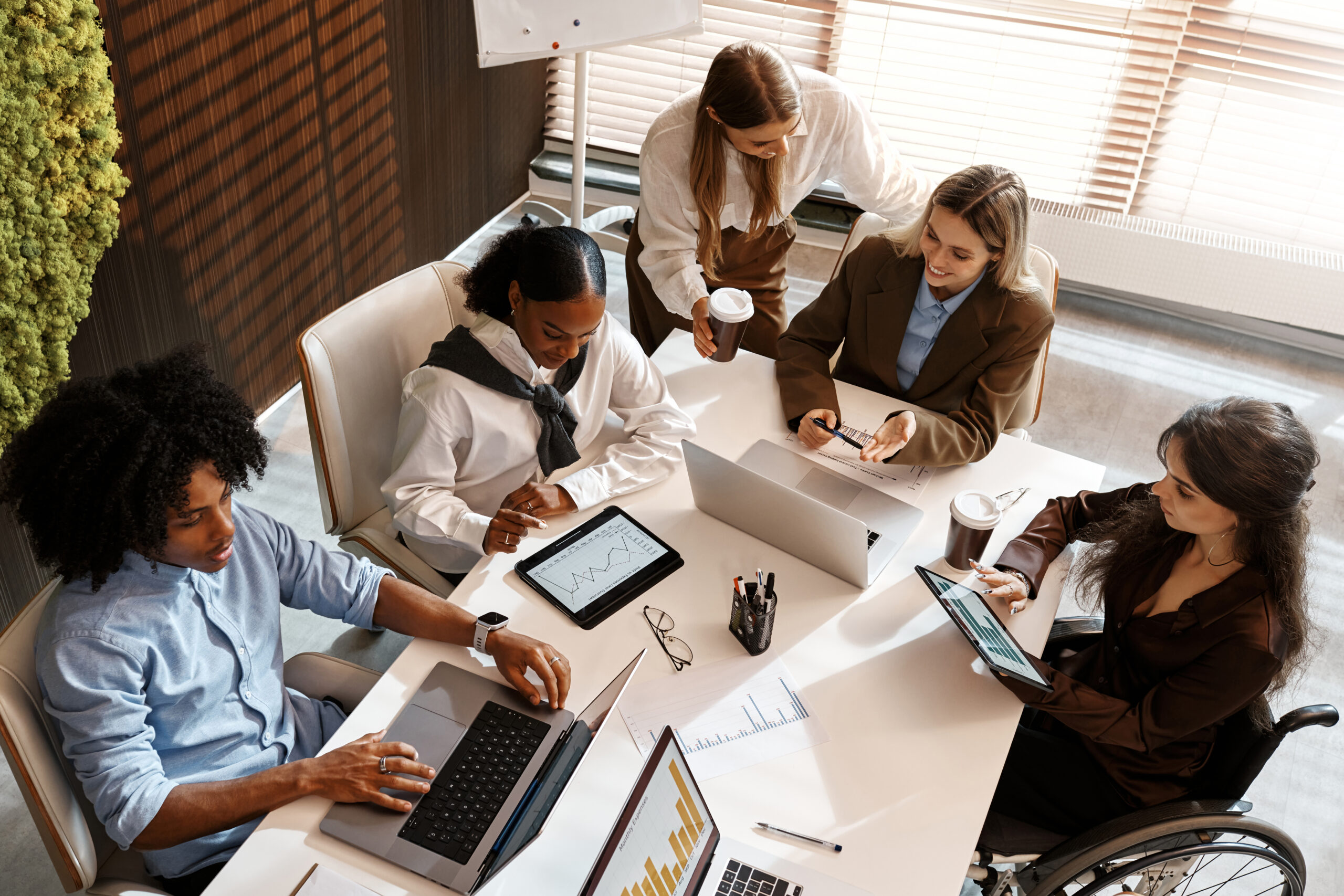 Business professionals collaborating using Databricks Genie for data driven decisions