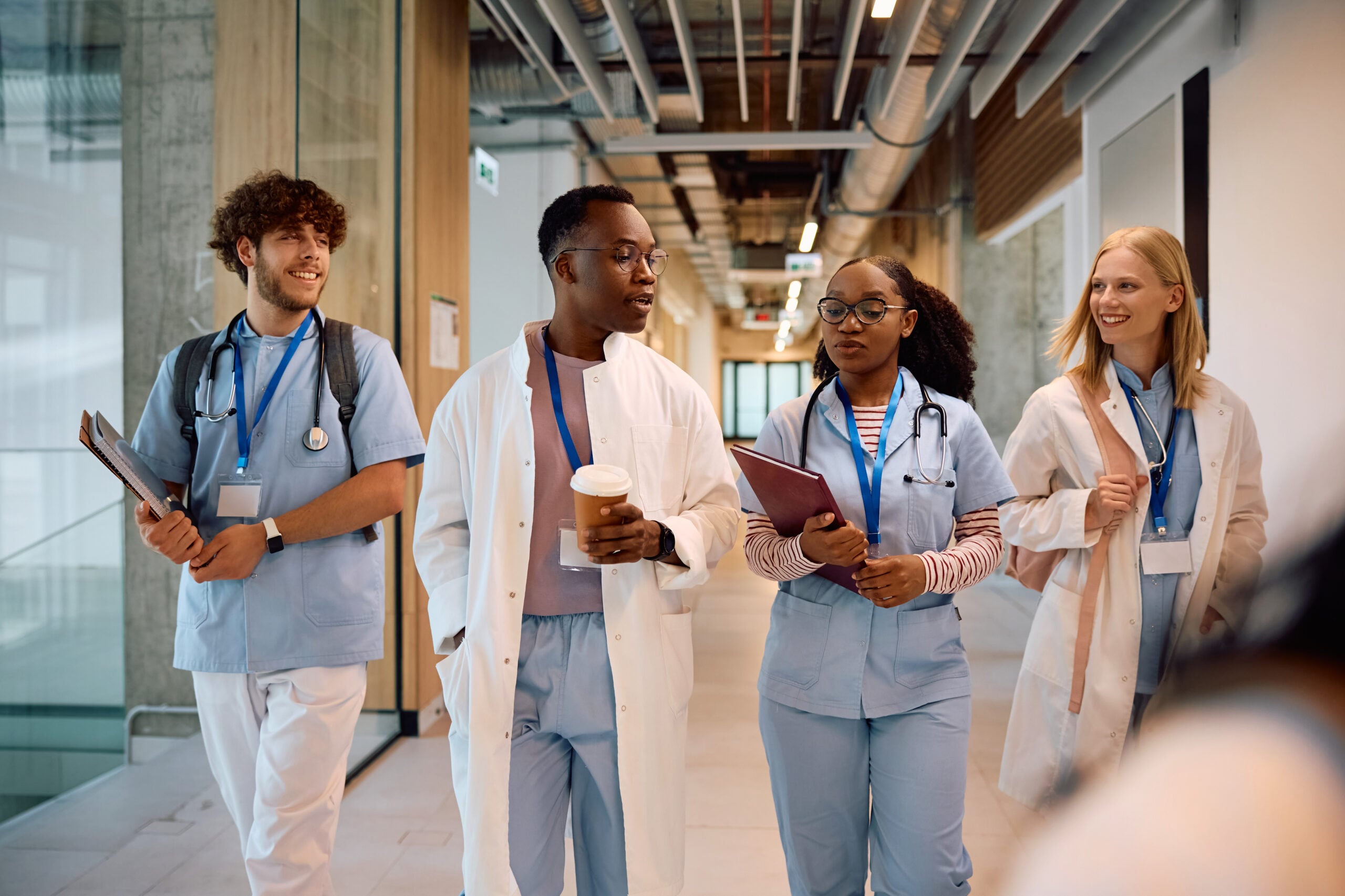 Multiracial group of student doctors going on a lecture at the university.