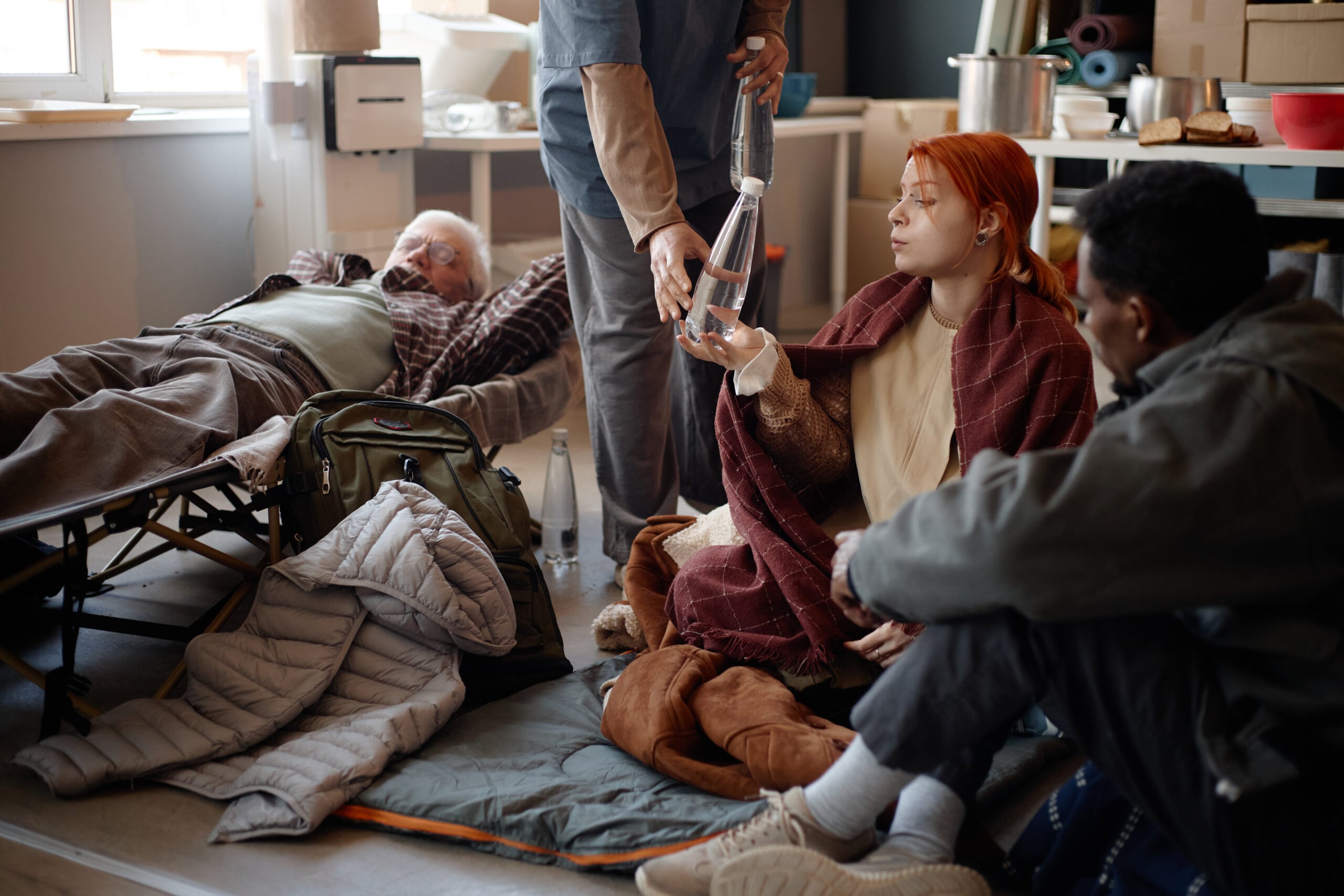 People receiving support in a temporary accommodation centre