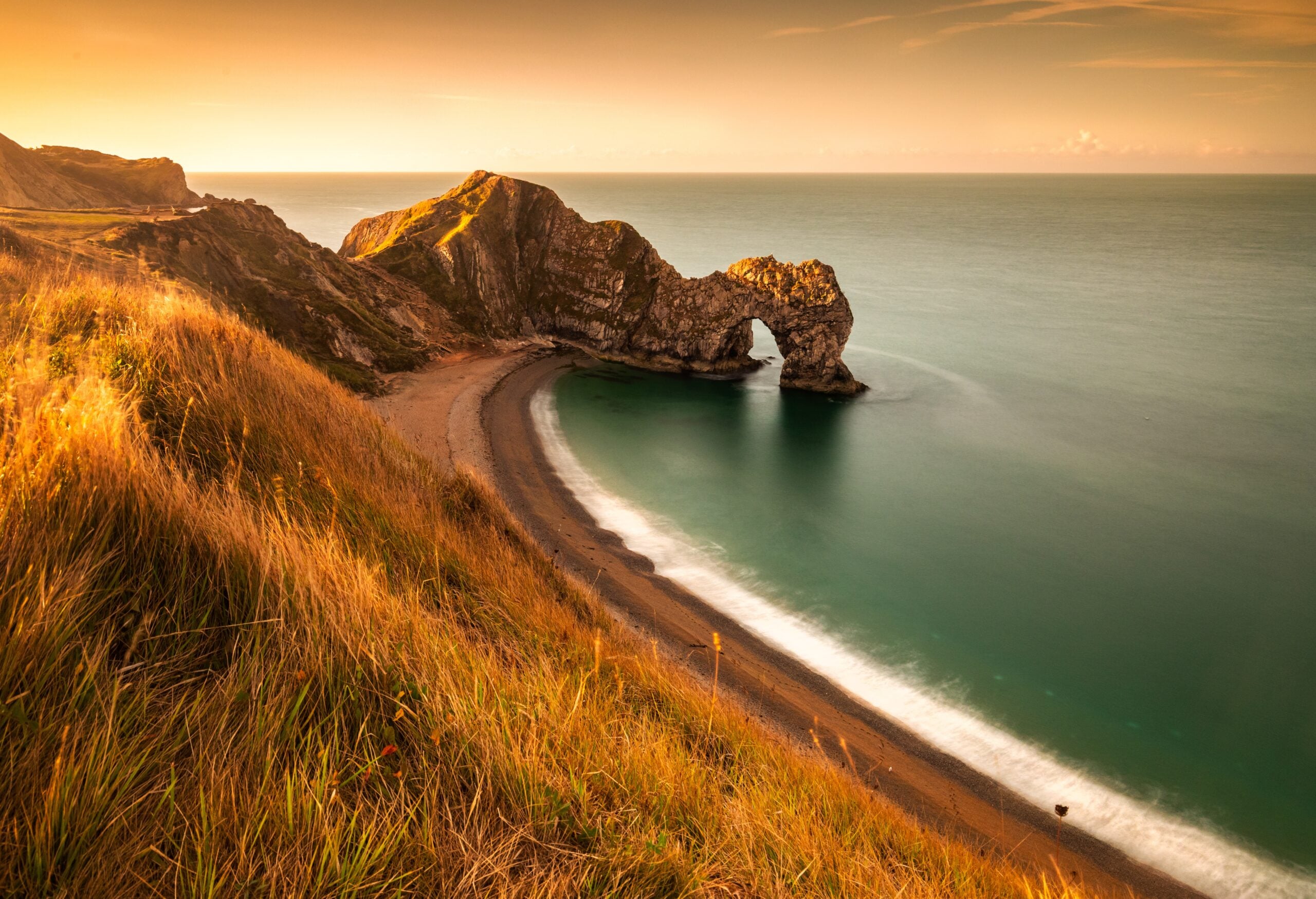 Coastal landscape at Durdle Door in Dorset with cliffs, beach and sea