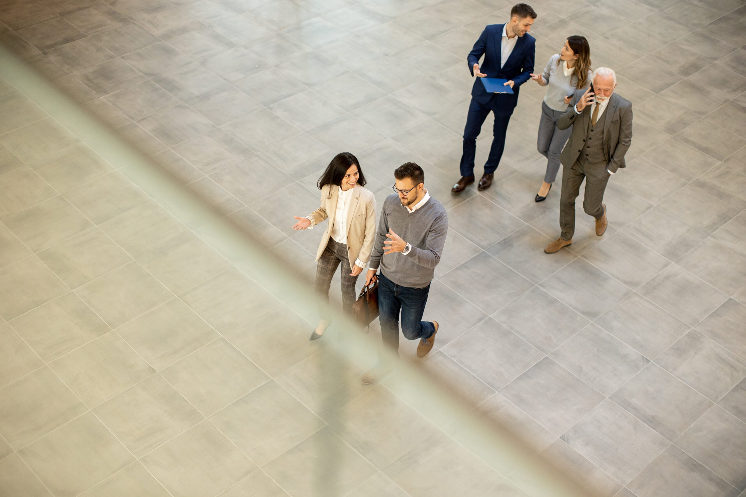 Diverse legal professionals collaborating using a Single Client View platform to improve client experiences and teamwork.