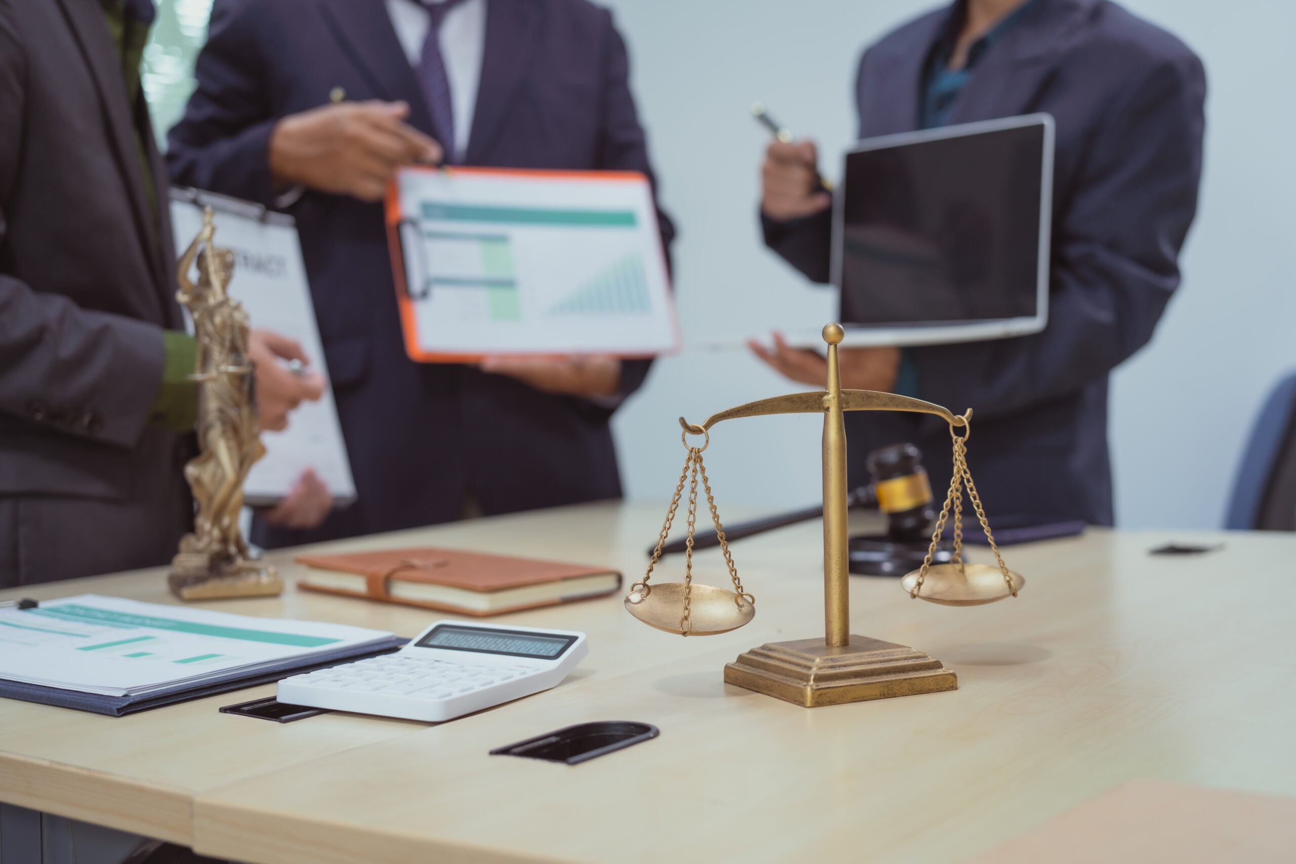 Legal team discussing client insights and performance data powered by a Single Client View solution.