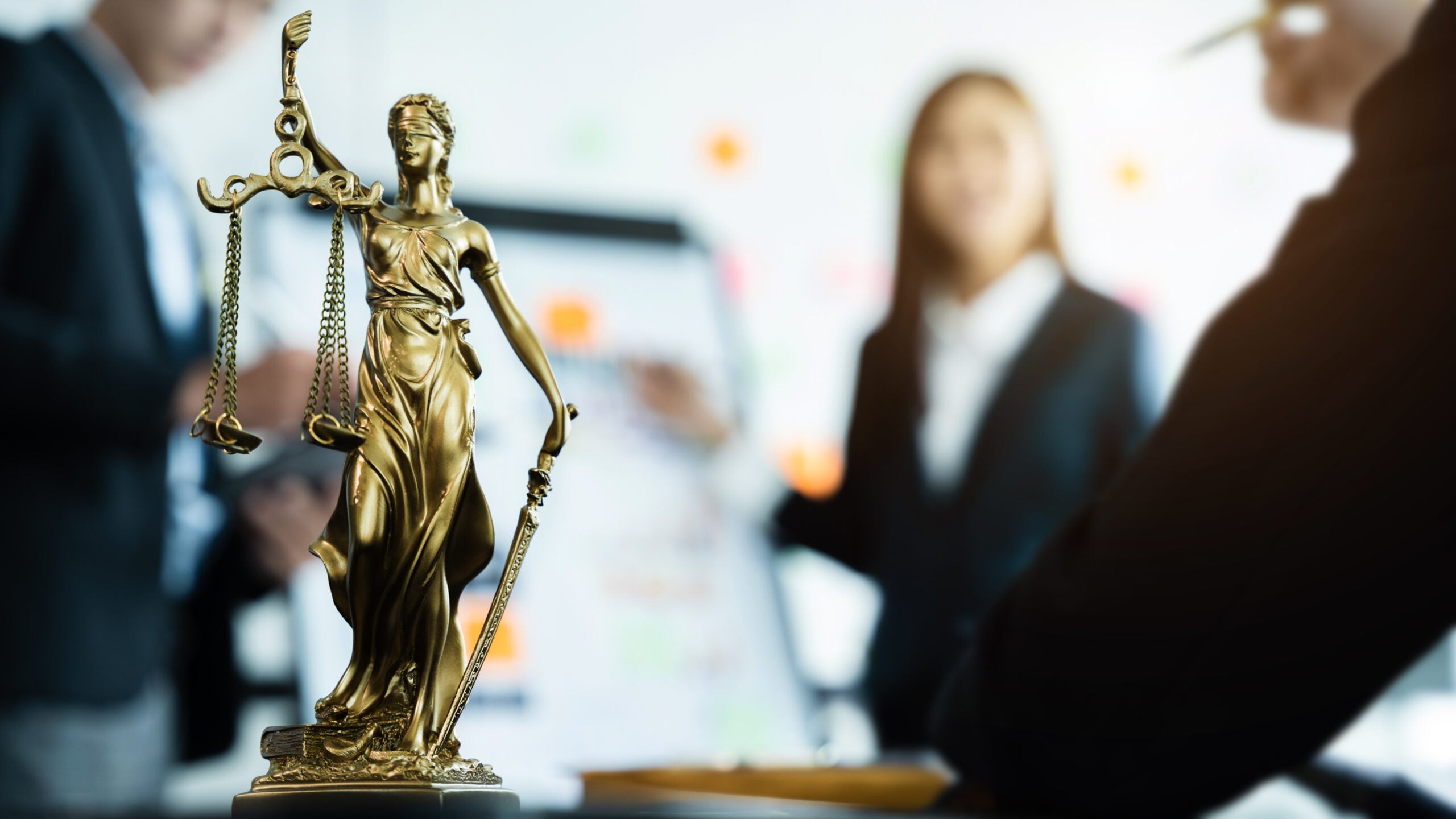 Lady Justice statue representing legal services supported by AI powered Single Client View technology.