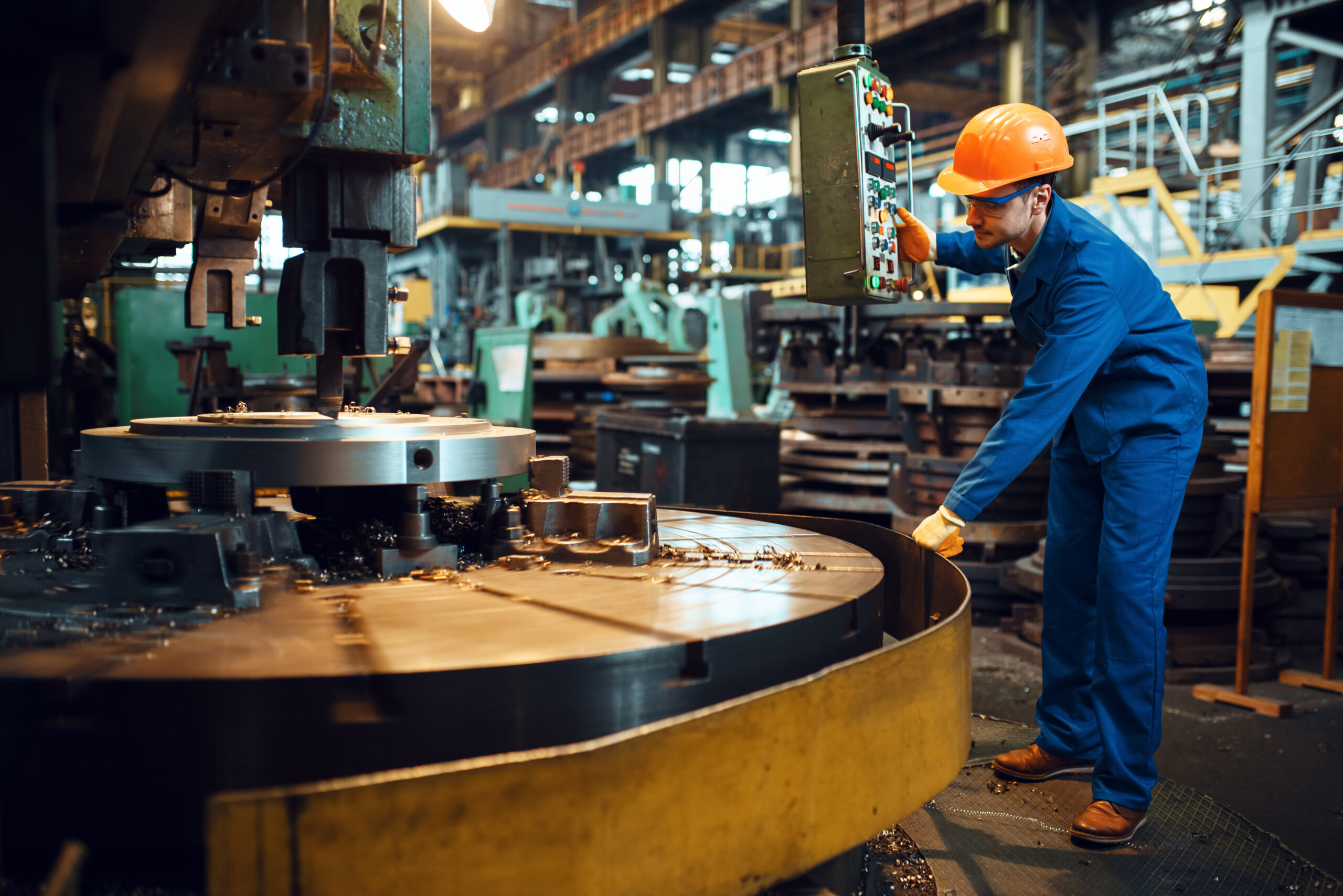 AI strategy development applied in manufacturing with engineer operating industrial machinery