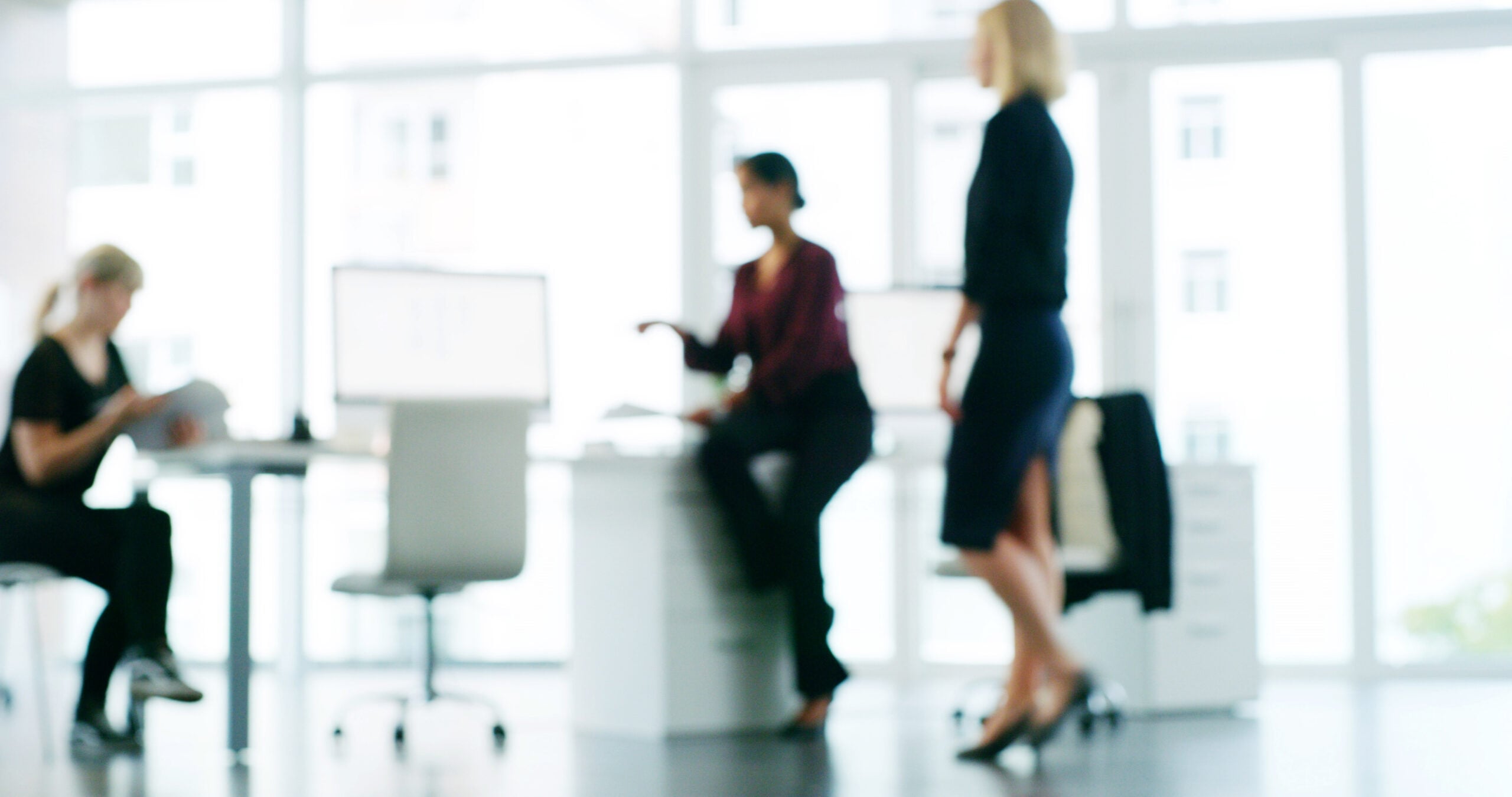 Business professionals discussing a data migration strategy for modernising enterprise systems