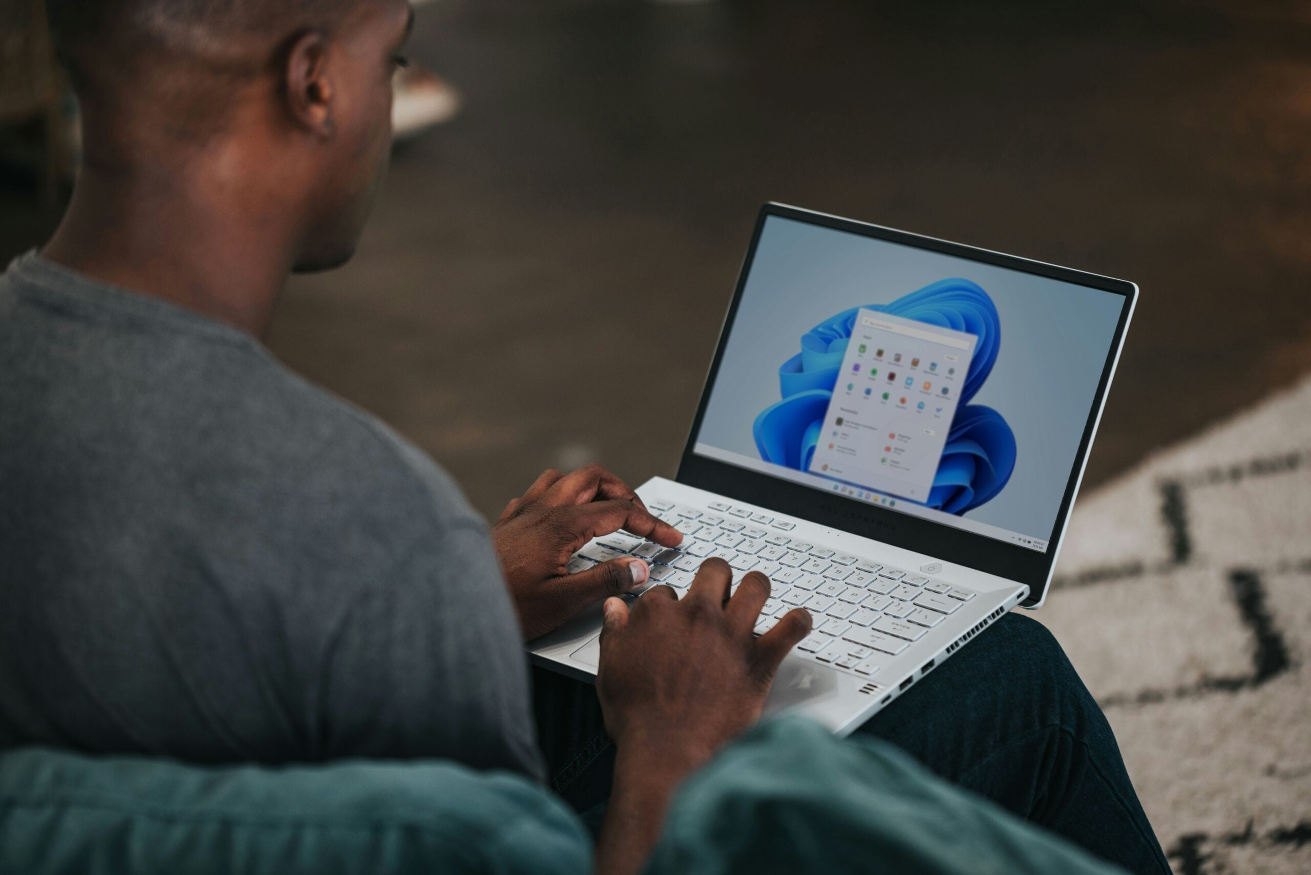The image shows someone on a windows laptop